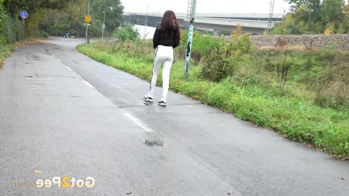 14P Maddi Black pulls down her pants before pissing in a puddle