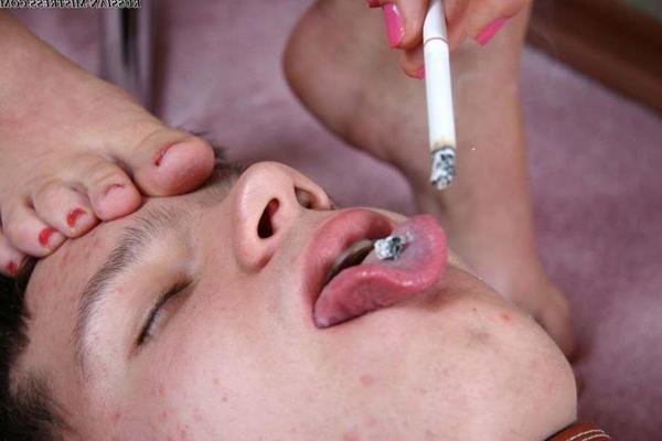 15P Sexy blonde uses her male slave as a human ashtray after foot worshiping play