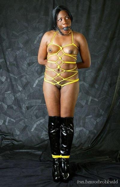 15P Ebony MILF loses her ball gag while tied up in black over the knee boots