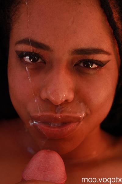 20P Beautiful ebony gives a spectacular interracial footjob and takes a facial