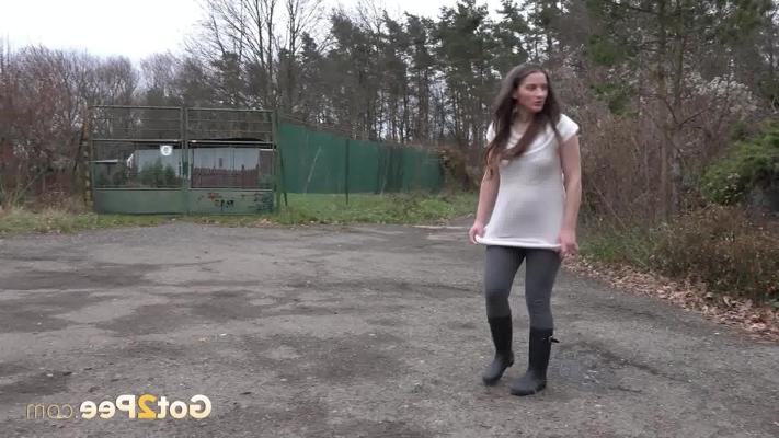 15P Short taken teen Nicolette Noir pees on a road while wearing rubber boots
