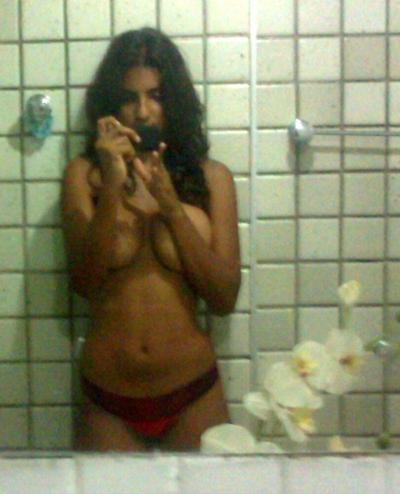 10P Indian girl takes selfies in a bathroom after unveiling her nice tits