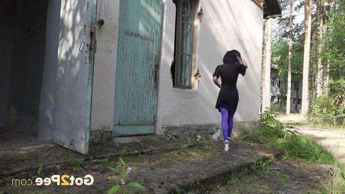 15P Flexible brunette Gypsy Queen takes a piss outside of an abandoned building