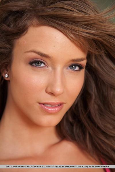 18P Glamour girl Malena Morgan showcases her shaved twat during lingerie removal