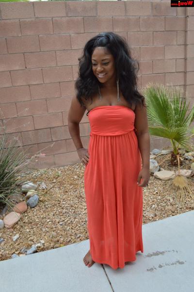 15P Gorgeous ebony babe WouJ shows off her stacked body in a long dress outdoors
