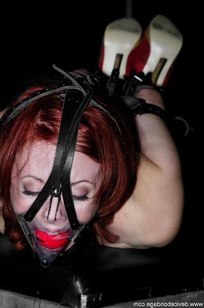 18P Naked slave woman Sabrina Sparx posing bound and ball-gagged in the dungeon