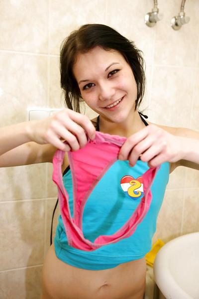 16P Slim teenage brunette slipping off her clothes and teasing her shaved slit