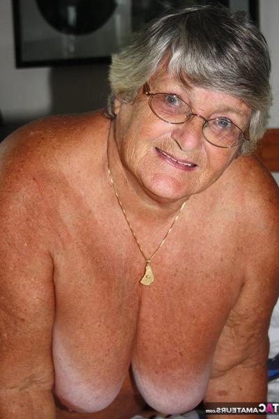 20P Fat old woman Grandma Libby frees her tan lined body from satin lingerie