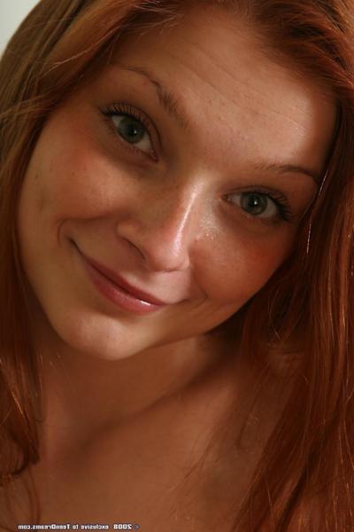 20P Hot redheaded babe Anna strips her dress & panties to pose naked