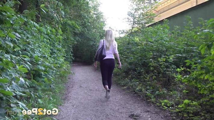 15P Blonde girl Delphine takes a pee on a dirt path near some greenery