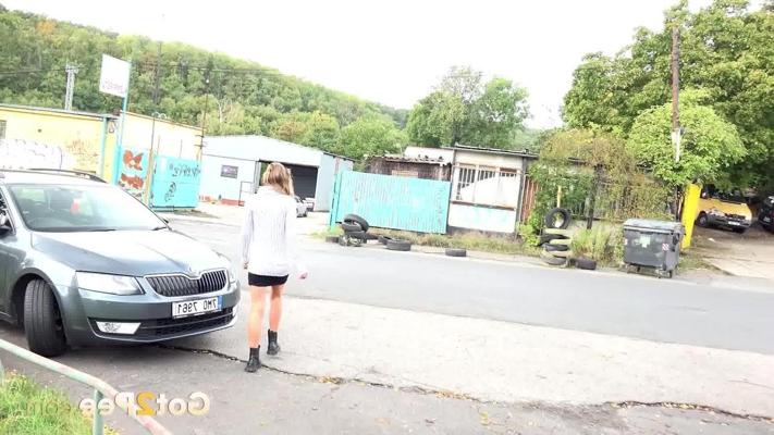 15P Blonde girl Claudia Macc pees beside a paved pedestrian path during the day