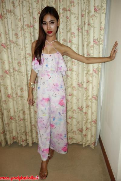 20P Pretty Asian shemale shows her lovely tits while teasing in a sexy outfit