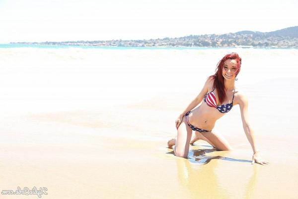 12P Pale redhead Kylie Cole doffs cutoffs to model USA themed bikini at the beach