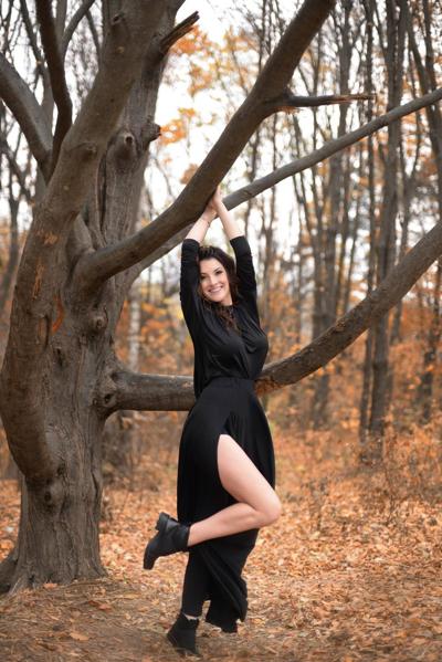 15P Amateur babe Adrianne Thelma reveals her hot legs and poses in a black dress