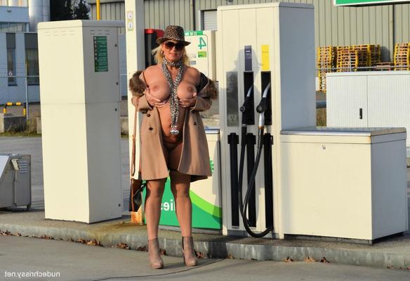 15P Naughty MILF Nude Chrissy shows off her big boobs wearing stockings outdoors