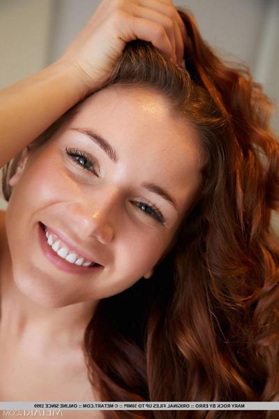 18P Young girl with long wavy red hair Mary Rock goes nude on a table