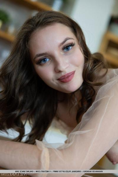 18P Beautiful brunette teen Viviann gets totally naked while in her kitchen