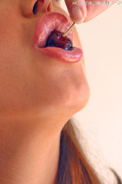 15P Pretty girl Sandra Shine curls her tongue while sucking juice from a cherry
