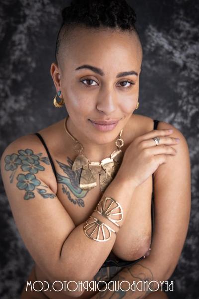 20P Ebony Mistress Tuesday showing off her great tattooed body in a solo