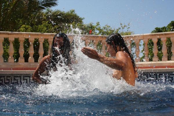 20P Hot babes with nice juggs Kari and Zaneta play with a sex toy in the pool