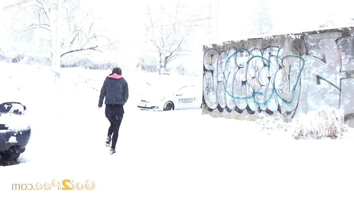 15P Lara Fox takes a piss beside a parked vehicle during a snowstorm