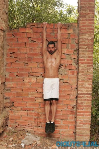 20P Dark-haired gay model Billy Baval posing naked and pissing outdoors