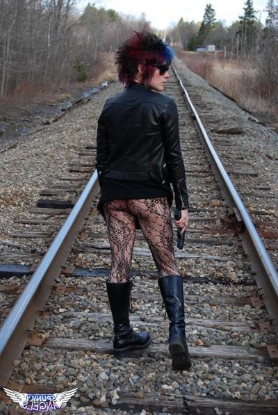 12P Punk girl Sabrina poses for an upskirt solo shoot on railway tracks