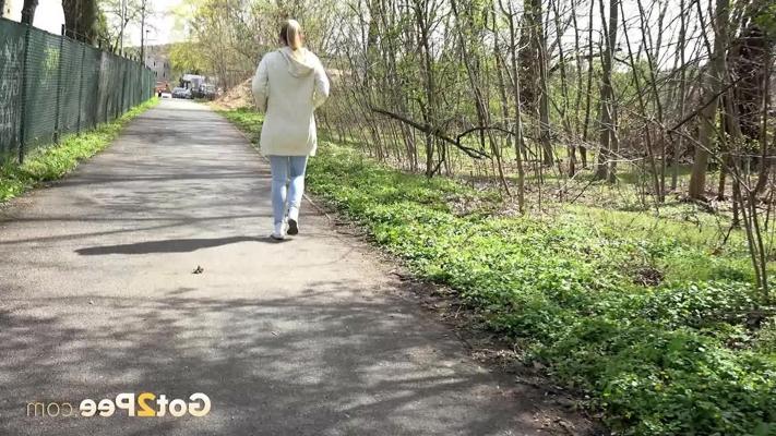 15P Blonde girl Bianca pulls down sweatpants to pee on a paved walking path