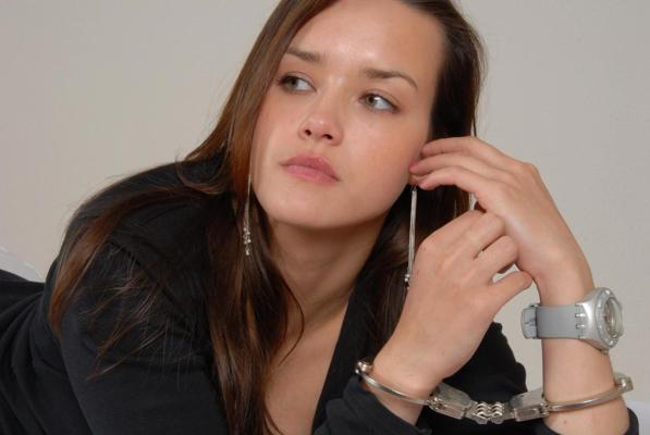 16P Pretty redhead Alice models a Swatch Scuba watch while handcuffed