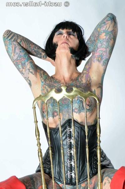 15P Solo girl Tattoogirl Cleo gets naked in a leather waist cincher and long boots