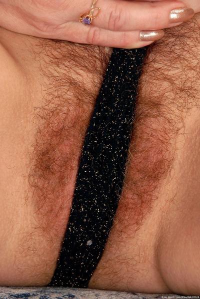 20P Mature lady Eva D spreads her hairy pussy during a sexy striptease