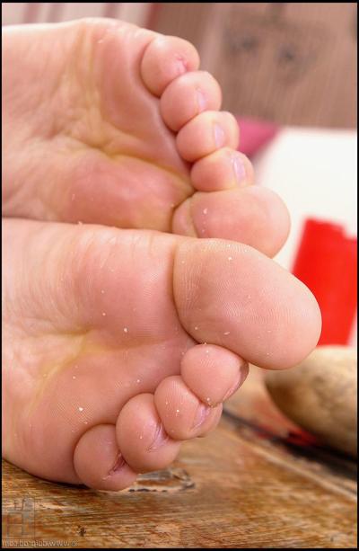 20P Big eyed blonde Trinity slowly exposes her feet and fingers her holes