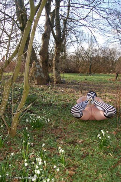 16P Dark haired girl is hogtied in striped socks while fitted with mouth spreader