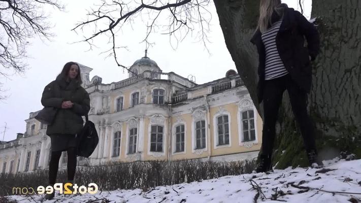 12P Blonde girl Masha pees on snow-covered ground against an old tree