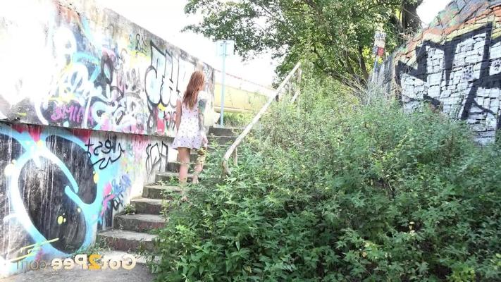 15P Tattooed redhead Foxie T takes a piss in a graffitied underpass