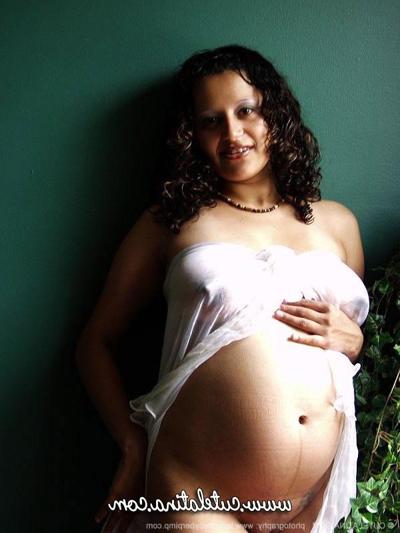 15P Pregnant Latina girl displays her swollen belly and vagina as well