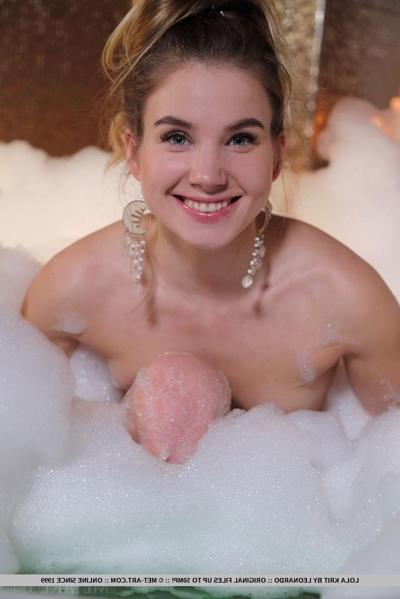 18P Nice teen Lola Krit wears her hair up with earrings while taking a bubble bath