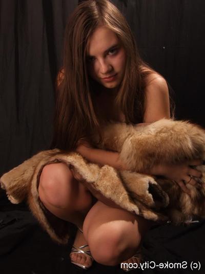 16P Amateur model smokes while removing fur coat for nude poses