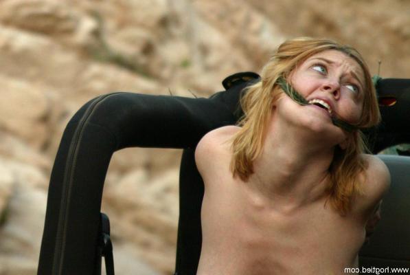 16P Naked MILF Dee Williams endures a rough offroad ride while standing in bondage