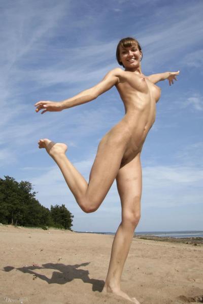 20P Skinny brunette Alina shows her adorable titties and poses nude on the beach