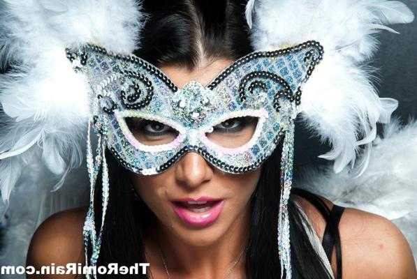 16P Dark haired MILF Romi Rain dons a masquerade mask while wearing angel wings
