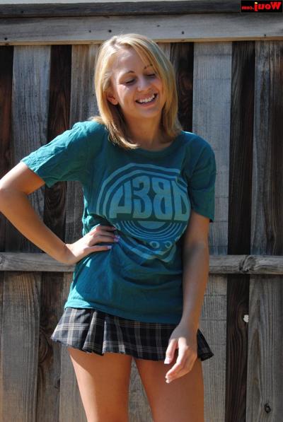 15P Blonde sweetie in a short skirt WouJ flashes her tasty booty outdoors