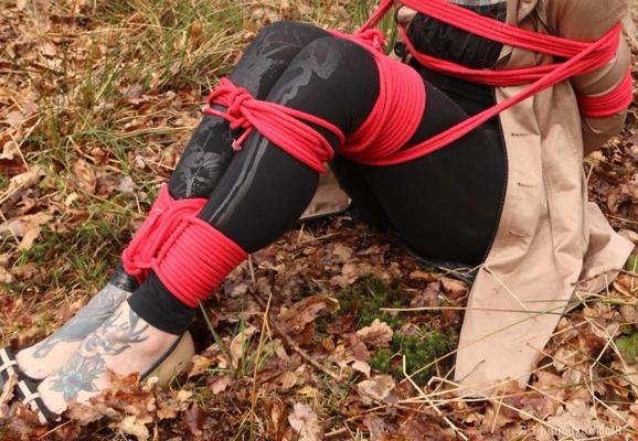 16P Natural redhead is left tied up and cleave gagged on dry leaves near the woods
