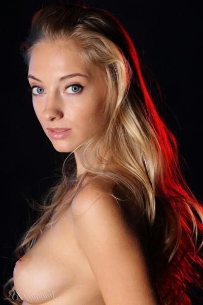 16P Gorgeous blonde model slips a long black dress over her perfect body