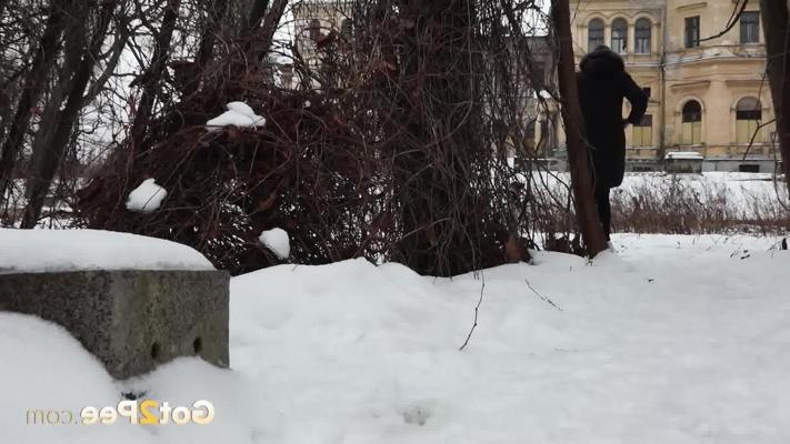 15P Short taken girl Vika squats for a piss on snow-covered ground in the city