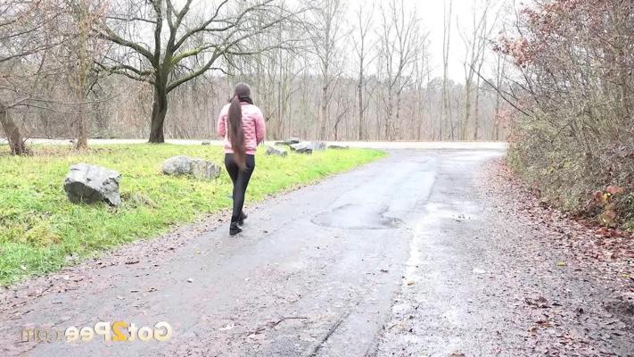 15P Caucasian girl Lara Fox pulls down her pants to pee on a wet path