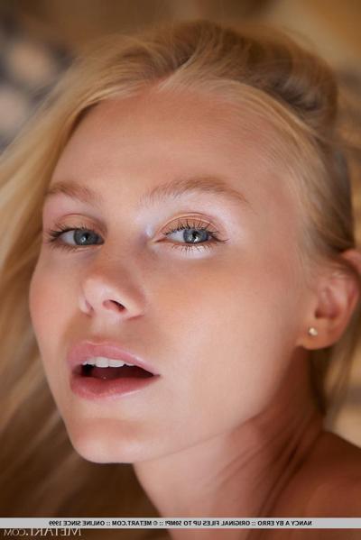 18P Beautiful blonde teen Nancy A gets totally naked on a chesterfield