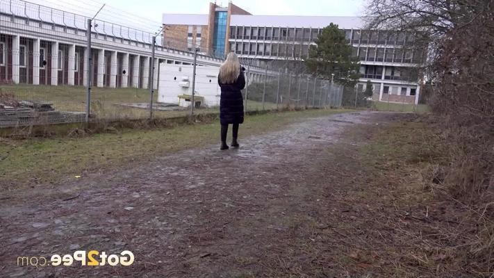 15P Blonde girl Bianca leans back against a tree while pissing in public