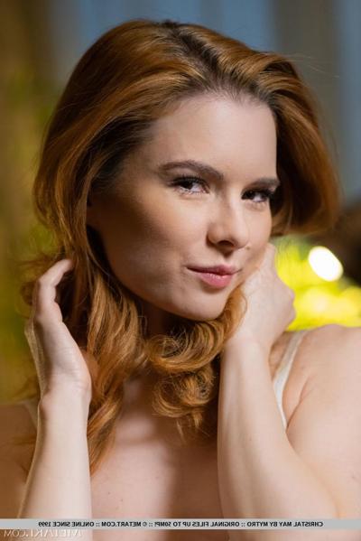 18P Young redhead Christal May does away with a bodysuit to pose in the nude
