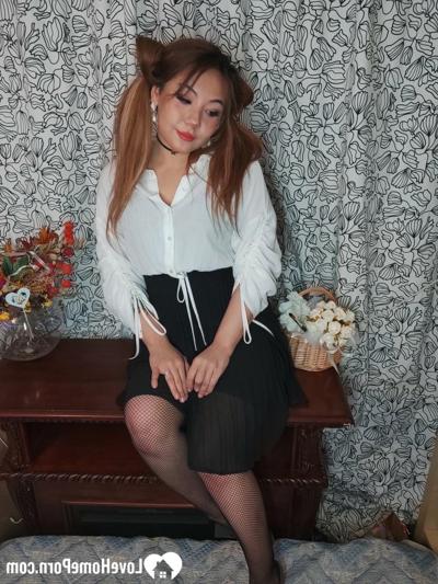20P Naughty Asian beauty masturbating in her corset and nylon stockings